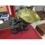 A set of cast iron kitchen scales with brass pan and weights