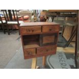 A collectors' chest of small proportions, four drawers and sliding door, a/f,