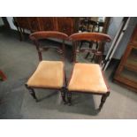 A set of six William IV rosewood dining chairs, scrolled back supports,