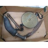 Two boxes of mixed militaria including mid 20th Century kukris,