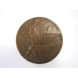 A WWI bronze memorial plaque / death penny named to WALTER BENYON LAWRENCE,