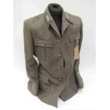A post-war German officer's tunic and a British Irish Guards 1959 pattern tunic,