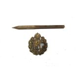 A WWI style flechete dart and a Royal Flying Corps hat badge (2)