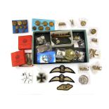 A collection of military badges, buttons and collectibles including Lusitania medallion,