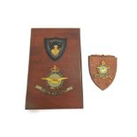 An RAF hand painted wall plaque and a Royal Canadian Air Force wall shield (2)