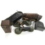 Two WWI German field telephone handsets with leather cases a/f