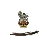 A gold brooch in the form of rampant lion upon a crown,