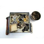 A box containing a collection of Police badges and buttons including Metropolitan and City of