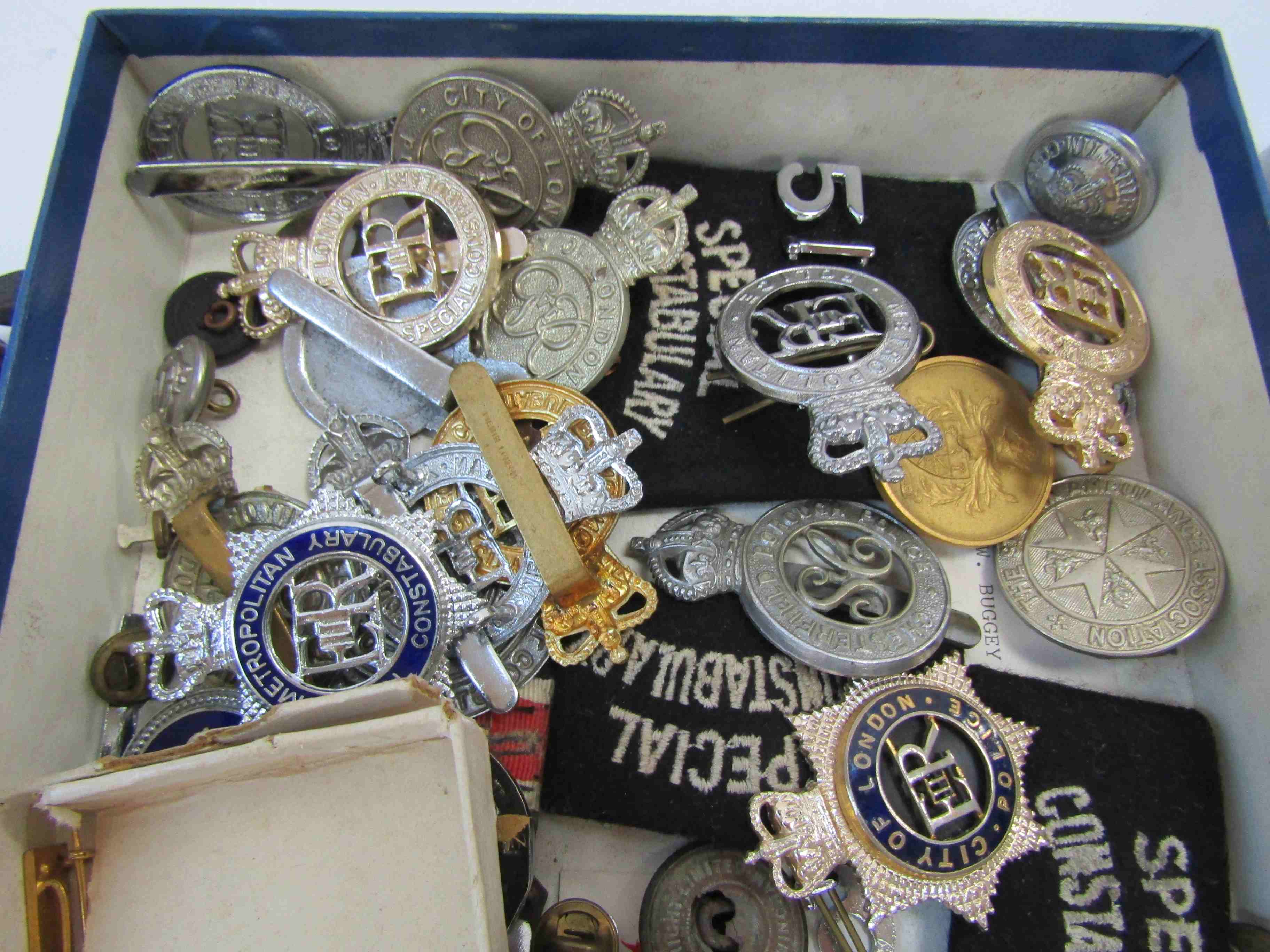 A box containing a collection of Police badges and buttons including Metropolitan and City of - Image 2 of 2