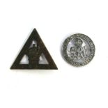 A WWI Women's "On War Service" 1916 badge of triangular form, stamped J.R.