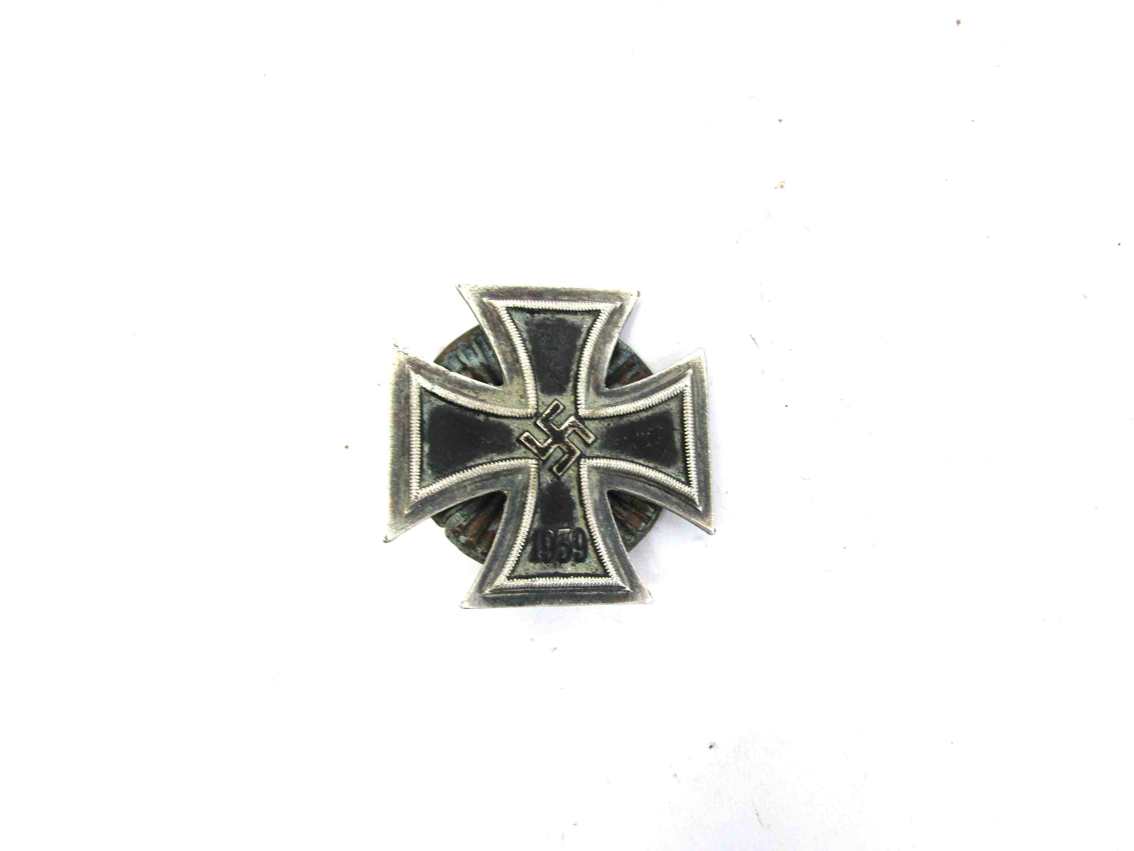 A German screw-back Iron Cross 1st class.