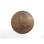 A WWI bronze memorial plaque / death penny named to WILLIAM WOOD
