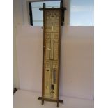 A 20th Century Admiral Fitzroys barometer in oak and glazed casing, paper charts and mercury tube,