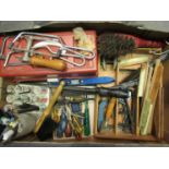 A box of mixed hand tools including screwdrivers,