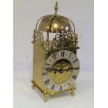 A late 19th/early 20th Century brass lantern clock of 18th Century design with Roman silvered