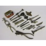 A collection of pin vices and clamps,