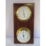 A Comitti of London weather station comprising timepiece and barometer, mounted on mahogany board,