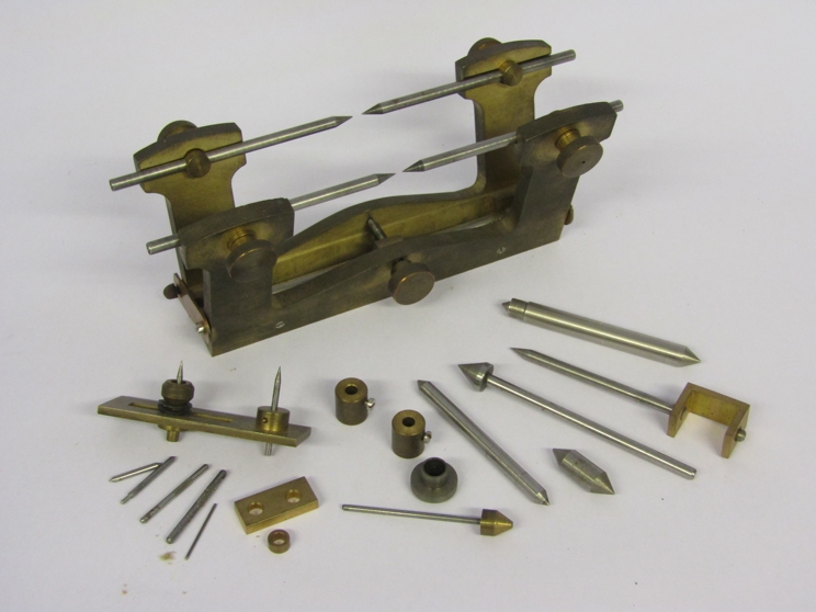 A handmade brass and steel clockmaker's depthing tool with various runners etc,