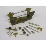 A handmade brass and steel clockmaker's depthing tool with various runners etc,