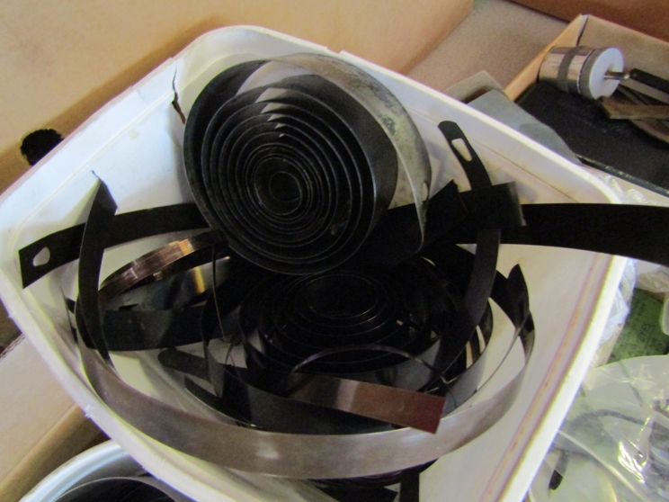 A box containing a large quantity of clock mainsprings, some unused, - Image 2 of 2