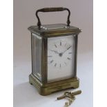 A late 19th Century French brass carriage timepiece with Roman enamelled dial (a/f),