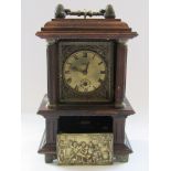An early 20th Century German musical/alarm mantel clock with brass Roman dial,