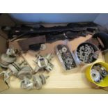 Two boxes of turret clock spares including hands, chains, leading off gears,