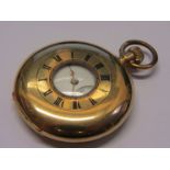 An 18ct gold half hunter keyless wind pocket watch, gold plating to winder and loop worn,