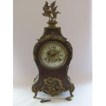 A 19th Century French ebonised and boulle work bracket clock of waisted form,