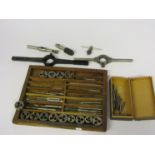A collection of mixed size taps and dies, diestocks,