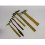 Four watchmaker's hammers including brass headed and ball pein,