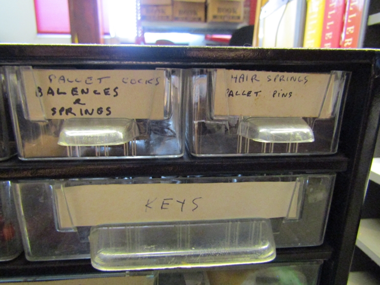 Three workshop drawer cabinets and various clock parts and consumables including clicks, - Image 6 of 7