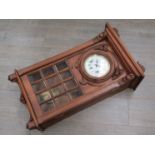 A late 19th Century walnut cased wall clock with Continental three train striking and chiming