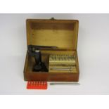 A Star jewelling set with various sized reamers and anvils,