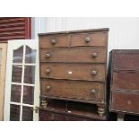 A Victorian mahogany two over three chest of drawers