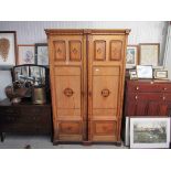 An Aesthetic period ash two door wardrobe unit with coloured parquetry decoration,