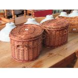 A pair of lidded wicker fishing baskets