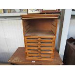 A 1950's habberdashers bank of six drawers by Tubor,