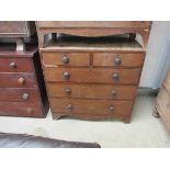 A Victorian mahogany two over three chest of drawers