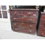 A Georgian mahogany two over three chest of drawers