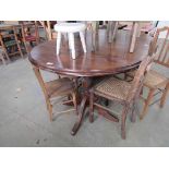 A stained pine kitchen table
