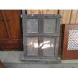 A late 19th Century oak lead glazed tavern window with sill