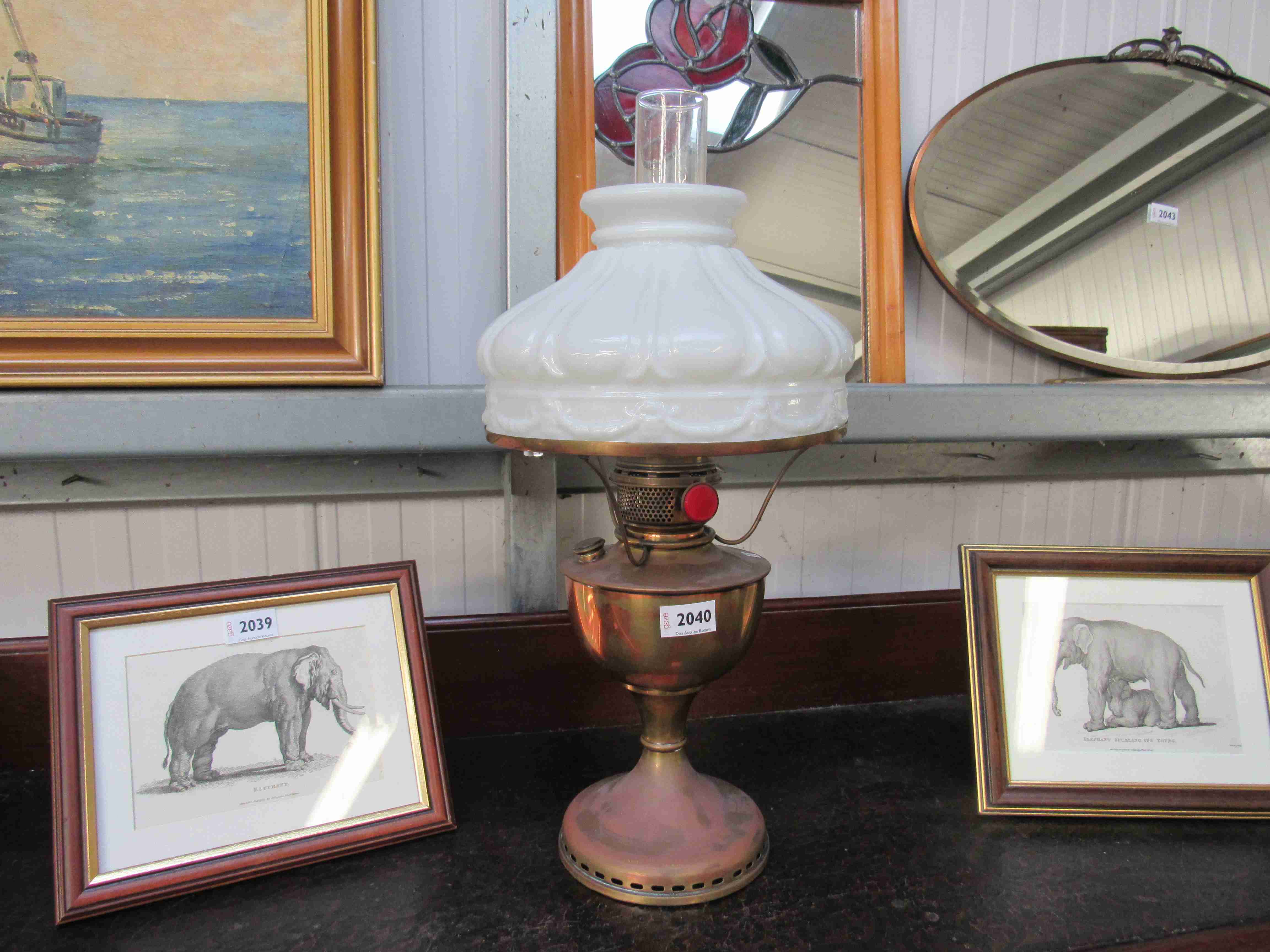 A 1920's oil lamp and shade