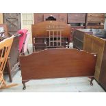 A 1930's mahogany Waring & Gillow bed with connecting bars,