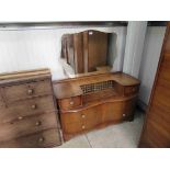 A 1950's walnut veneered wardrobe and dressing chest