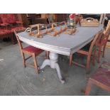 A grey painted twin pedestal table,