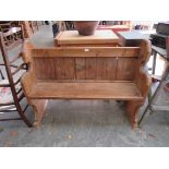 A small Victorian style pine pew,