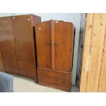 A small 1940's walnut two door wardrobe