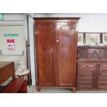 A late 19th Century Georgian style mahogany two door wardrobe