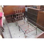 A Victorian strap iron and brass campaign day bed